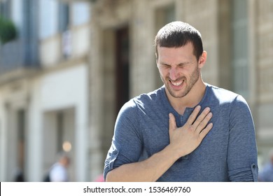 Stressed Adult Man Complaining Suffering Chest Ache Standing In The Street