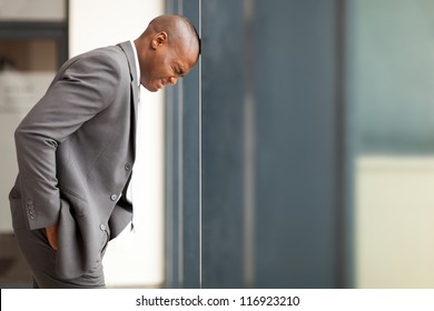 Stressed African American Businessman Bang His Head Against Wall