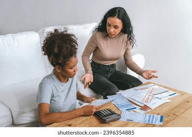 Stressed African American women has financial problems with credit card debt to pay crucial show concept of bad personal money and mortgage pay management crisis. - Shutterstock ID 2396354885