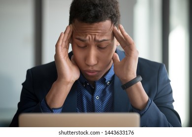 Stressed African Business Man Exhale Massage Temples Relieving Headache Work Stress, Worried Black Businessman Suffer From Strong Migraine At Workplace Feel Dizzy Tired Exhausted Coping With Pain