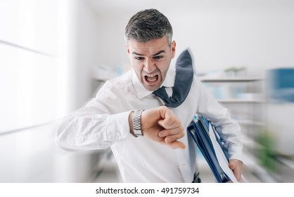 Stressed Anxious Businessman In A Hurry Checking Time And Running, He Is Late For His Business Appointment