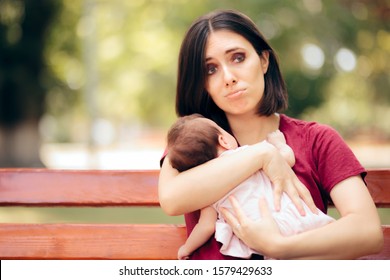 Stressed Anxious Mother Holding Newborn Daughter. Worried New Mom With Baby Girl In Her Arms
