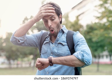 Stressed And Anxious Young Man In A Hurry, Checking Time And Running, Being Late