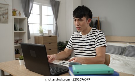 Stressed Asian Korean Student Learning From Home Is Confused And Surprised By A Sudden Data Loss While Typing School Report On The Laptop In The Bedroom.