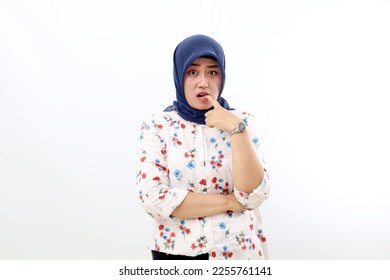 Stressed asian muslim woman standing with scared face expression. Isolated on white background - Shutterstock ID 2255761141
