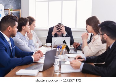 Stressed boss having problem at business meeting in office - Shutterstock ID 1172574172