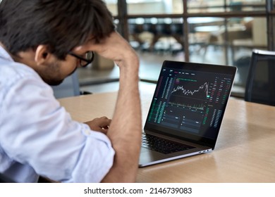 Stressed business man crypto trader broker investor analyzing stock exchange market crypto trading decreasing chart data fall down loss, desperate about losing money of crisis, recession, inflation. - Shutterstock ID 2146739083