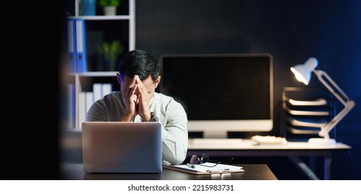 Stressed business man working over time at night. business account and finance concept - Powered by Shutterstock