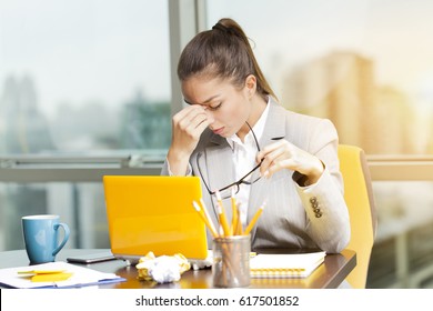 Stressed Business Woman Working On A Laptop