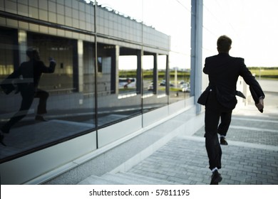 Stressed Businessman Running Away