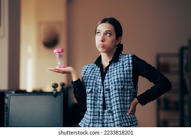 
Stressed Businesswoman Holding an Hourglass in the Office. Unhappy manager evaluating tome performance of business team
 - Shutterstock ID 2233818201