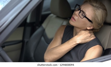 Stressed Businesswoman Suffering Neck Discomfort, Sitting In Car, Sedentary Life