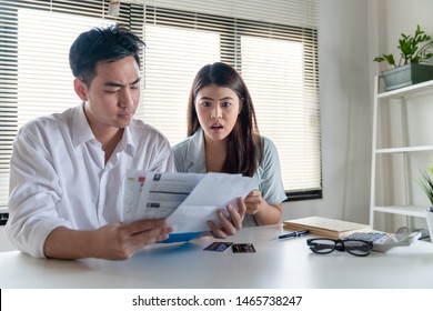 Stressed Couple Young Family Husband And Wife Looking So Many Expenses Bills Such As Electricity Bill,
Water Bill,internet Bill,cell Phone Bill And Credit Card Bill In His Hand No Money To Pay Debt