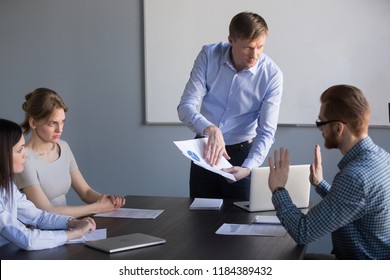 Stressed employee disagreeing with boss blaming for mistake in financial report, dissatisfied ceo team leader arguing with worker about bad work charging fault upon duties failure or demanding result