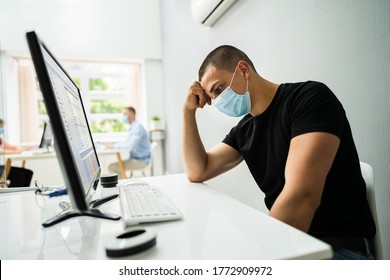 Stressed Employee In Office Wearing Face Mask