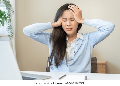 Stressed, exhausted asian young woman, girl pain from vertigo, having migraine symptoms headache, feel unhealthy, suffering from dizziness, holding head with hand. Health care problem of people. - Powered by Shutterstock