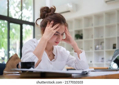 Stressed Female Employee Feeling Tired At Work, Suffering From Headache, Stress At Work Or Migraine. 