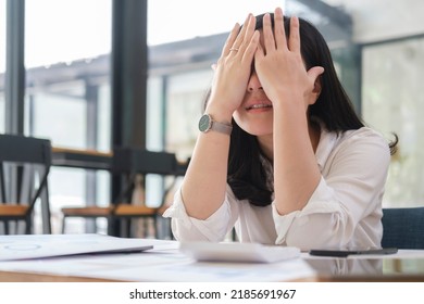 Stressed Female Employee Feeling Tired At Work, Suffering From Headache, Stress At Work Or Migraine.	