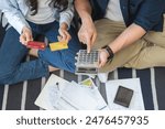 Stressed financial owe asian young couple love sitting stressed and confused hand calculate expense from credit card, invoice no money to pay, mortgage or loan. Debt, bankrupt or bankruptcy people.