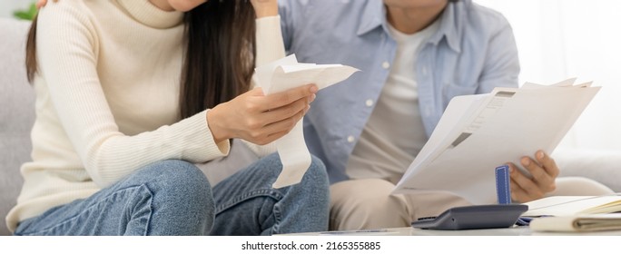 Stressed Financial Owe Asian Young Couple Love Sitting Suffer, Stressed And Confused By Calculate Expense From Invoice Or Bill, No Money To Pay, Mortgage Or Loan. Debt, Bankrupt Or Bankruptcy People.