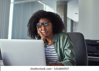 Stressed Frustrated Young Businesswoman Looking At Laptop