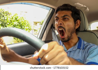 Stressed, Furious And Angry Male Driver In His Car Stuck In Traffic Jam. Boy Stuck In Traffic Jam. 