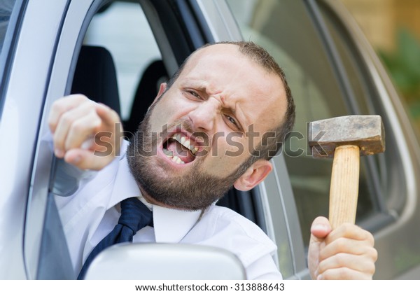 Stressed and furious driver\
in his car