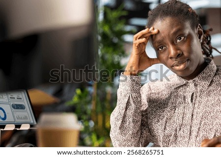 Stressed general manager working under pressure on crucial organizational tasks, dealing with burnout and mental exhaustion. African american woman getting overwhelmed by project deadlines.