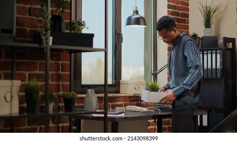 Stressed Man Getting Fired From Company Job And Packing Up Office Things In Box. Jobless Person Feeling Unhappy And Frustrated About Being Dismissed From Business Work. Unemployment