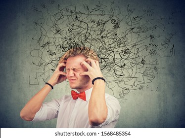 Stressed man with a mess and confusion in his head 