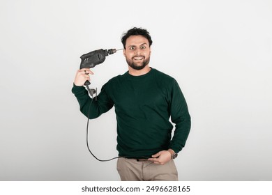 Stressed man putting drill against his head. Remodeling stress concept. Burnout concept. - Powered by Shutterstock