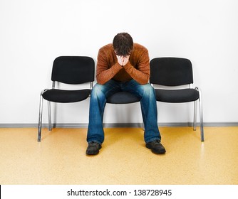 Stressed Man In A Waiting Room