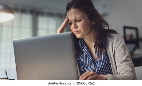 Stressed office worker having a headache, job burnout concept