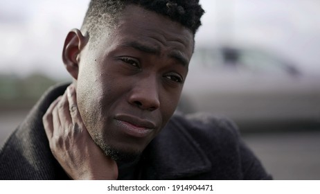 Stressed Ou Black African Man Feeling Neck Pain Due To Emotional Struggle