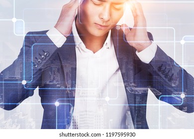 Stressed Out Young Asian Businessman With Severe Headache. Double Exposure Of Cityscape And Immersive Interface. Hi Tech And Its Influence On Daily Life Concept. Toned Image Double Exposure