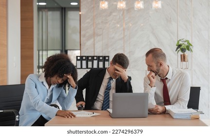 Stressed overwhelmed businesspeople feels tired at corporate meeting, exhausted businesspeople suffering from headache touching temples at team briefing, stress at meeting room - Powered by Shutterstock