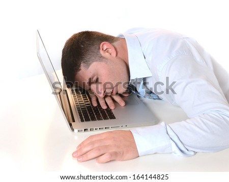 Stressed  Overworked Businessman sleeping over keyboard at Work 