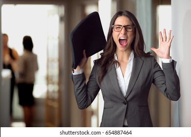 Stressed Panicked Business Woman At The Office Freaking Out, Overwhelmed, Frustrated Scream 