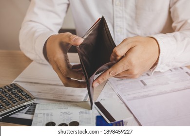 Stressed, Problem Business Person Man, Male Holding And Open An Empty Wallet Not Have Money, Credit Card, Not To Payment Bill, Loan Or Expense In Pay. Bankruptcy, Bankrupt And Debt Financial Concept.