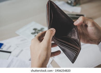 Stressed, Problem Business Person Man, Male Holding And Open An Empty Wallet Not Have Money, Credit Card, Not To Payment Bill, Loan Or Expense In Pay. Bankruptcy, Bankrupt And Debt Financial Concept.