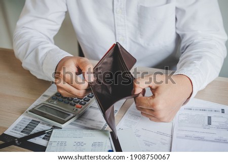 Stressed, Problem business person man, male holding and open an empty wallet not have money, credit card, not to payment bill, loan or expense in pay. Bankruptcy, bankrupt and debt financial concept. Stock photo © 