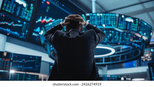 Stressed Stock Exchange Trader Can't Apprehend a Sudden Stock Market Collapse. Financial Crisis Concept with Stock Broker Saddened by Negative Ticker Information, Red Graphs and Real-Time Data - Powered by Shutterstock