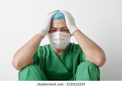 Stressed Tired Healthcare Worker Sitting On Floor After Long Shift Fighting Against Coronavirus