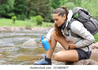 Stressed Trekker Alone Suffering Belly Ache After Drinking River Water In The Mountain