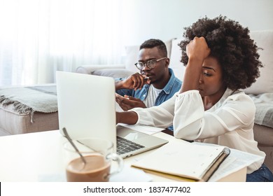 Stressed Unhappy Couple Arguing About Huge Expenses With Laptop And Papers, Angry Husband Blaming Wife Of Overspending Debt, Family Having Conflict Fight About Wasting Money Financial Problem At Home