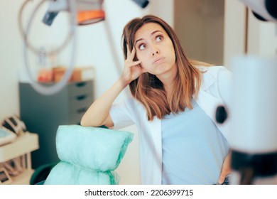 
Stressed Unhappy Dentist Feeling Overwhelmed And Confused
Sad And Tired Healthcare Worker Feeling Exhausted At The Workplace
