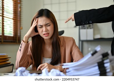 Stressed And Unprofessional Millennial Asian Businesswoman Or Female Office Worker Gets A Work Complaint From Her Boss. Fired, Work Mistake, Job Pressure.