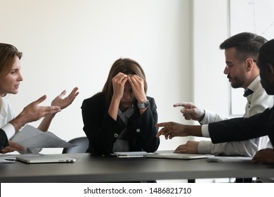 Stressed upset business woman suffer from angry colleagues clients arguing shouting at group meeting bullying humiliating female worker, harassment, stress and discrimination at workplace concept - Powered by Shutterstock