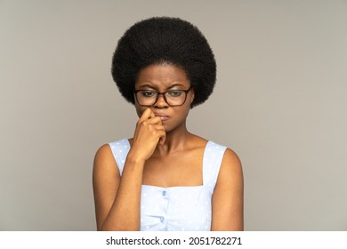 Stressed upset young woman thoughtful thinking of problem solution with unhappy face expression. Doubtful depressed black girl staring at one point pensive of important decision tired has depression - Shutterstock ID 2051782271
