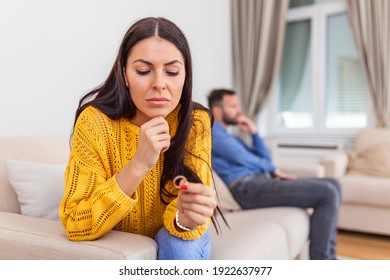 Stressed Wife Holding Her Wedding Ring Worried About Breakup Or Divorce, Avoid Talking With Husband After Fight, Anxious Couple Ignore Each Other. Frustrated Sad Wife Taking Off The Wedding Ring